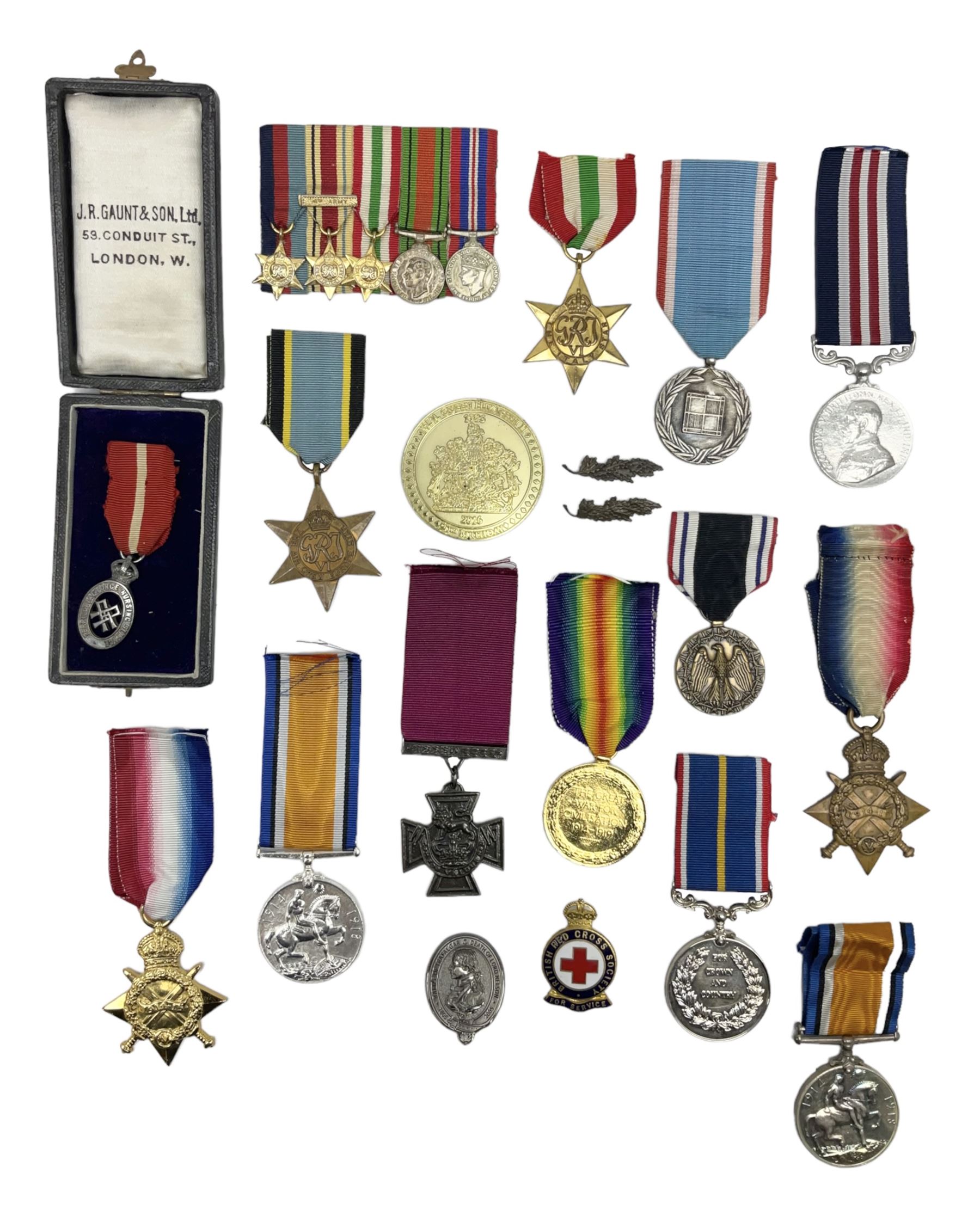 Gaunt & Son Territorial Force Nursing Service cape medal; cased; WW1 British War Medal and 1914-15 Star (names erased); two MID oak leaves; Polish and American medals; eight replica medals including VC, MM, Air Crew Europe Star etc and replica group of five WW2 miniatures etc