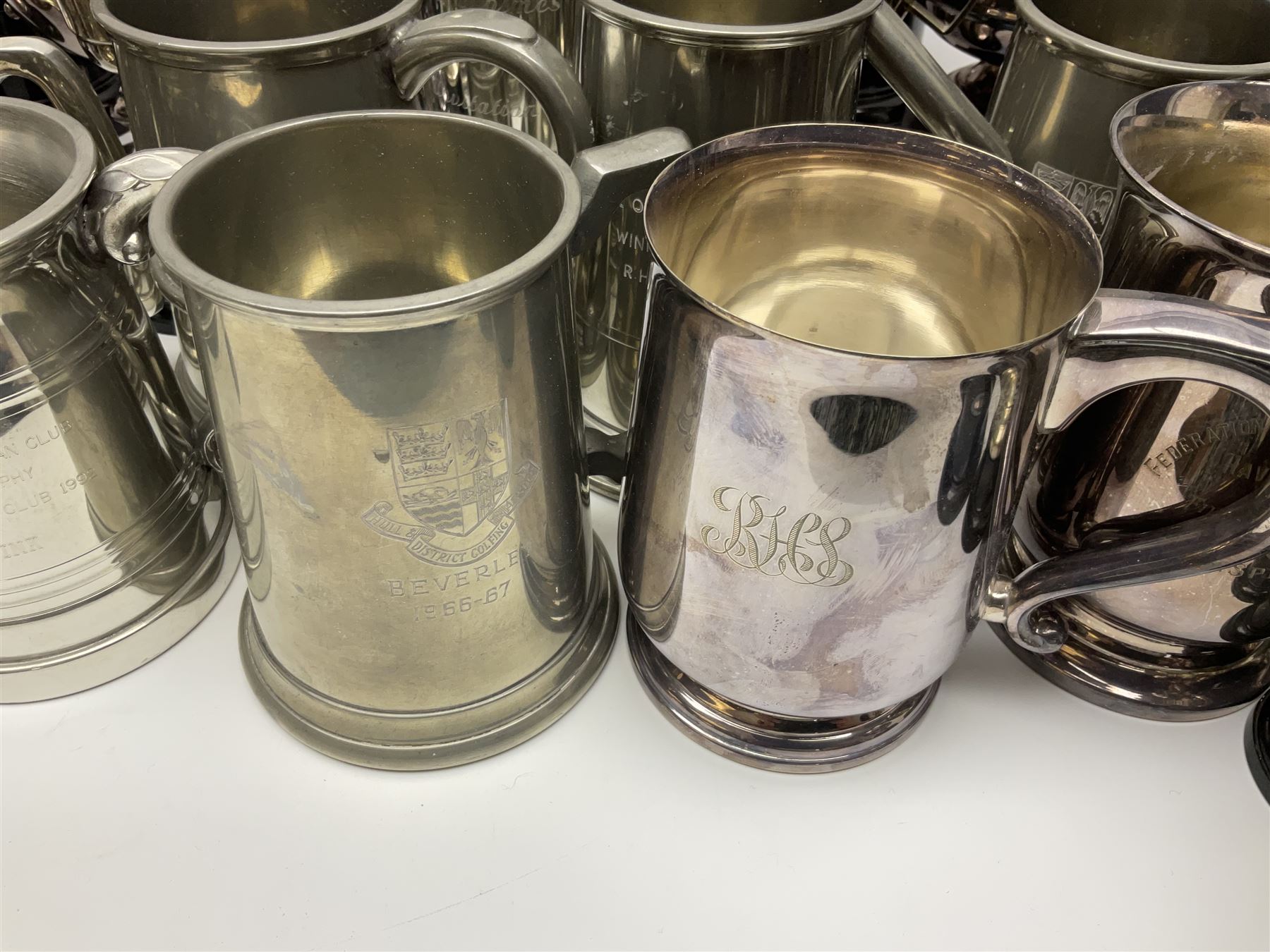 Collection of pewter and silver-plated trophy cups and presentation tankards, largest H28cm
