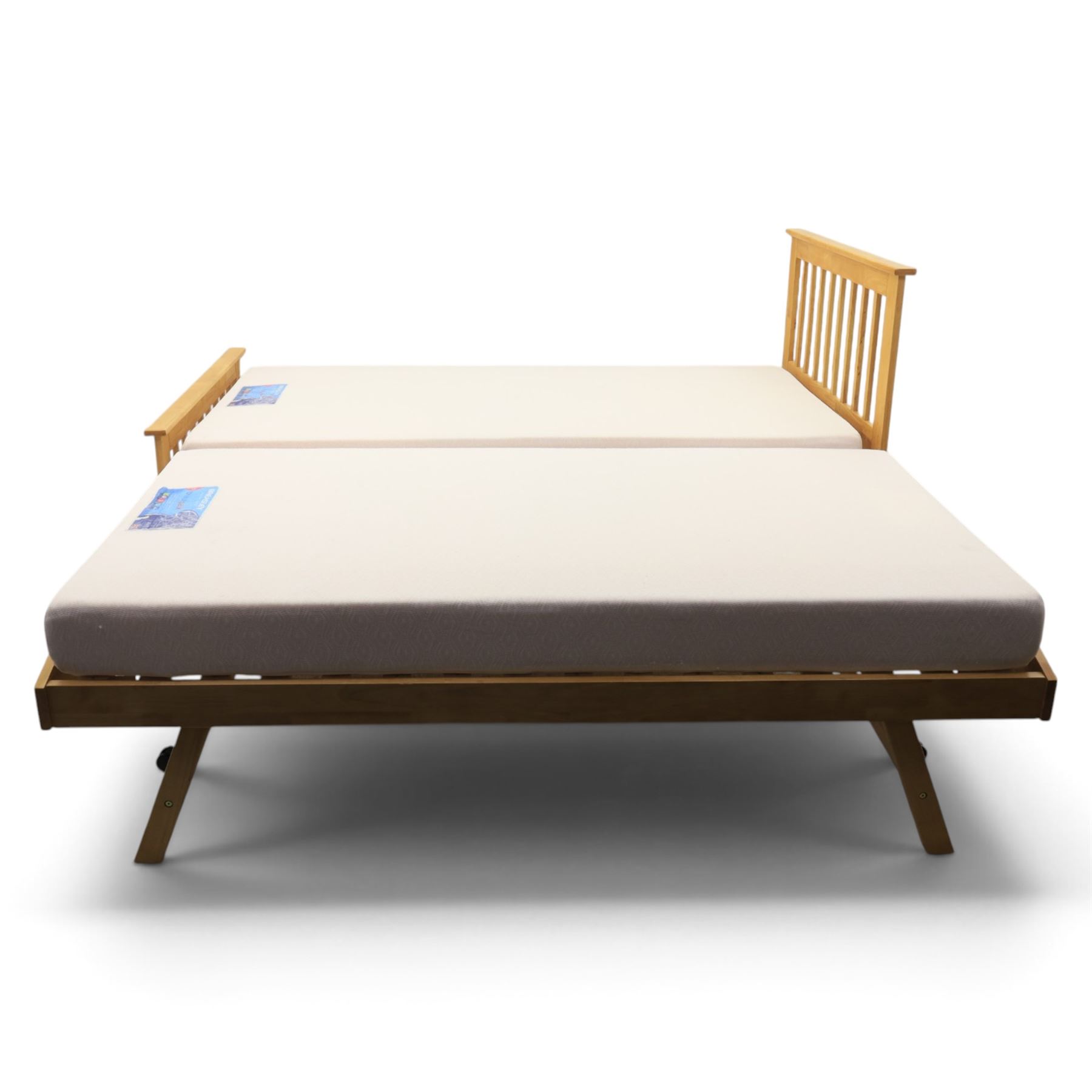 Contemporary light oak trundle bed, slatted headboard and footboard,  incorporating pull-out trundle bed on castors, complete with two memory foam mattresses
