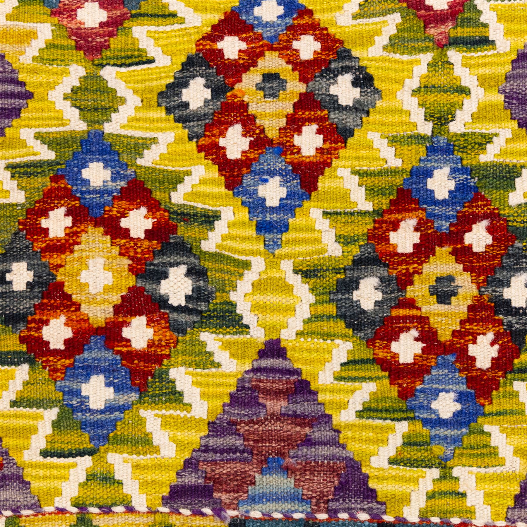 Afghan Maimana kilim flatweave runner, central field features large bold nested diamond motifs and stylized geometric lozenge patterns on olive purple, blue, and green tone ground, border stripe in teal ground, and fringe