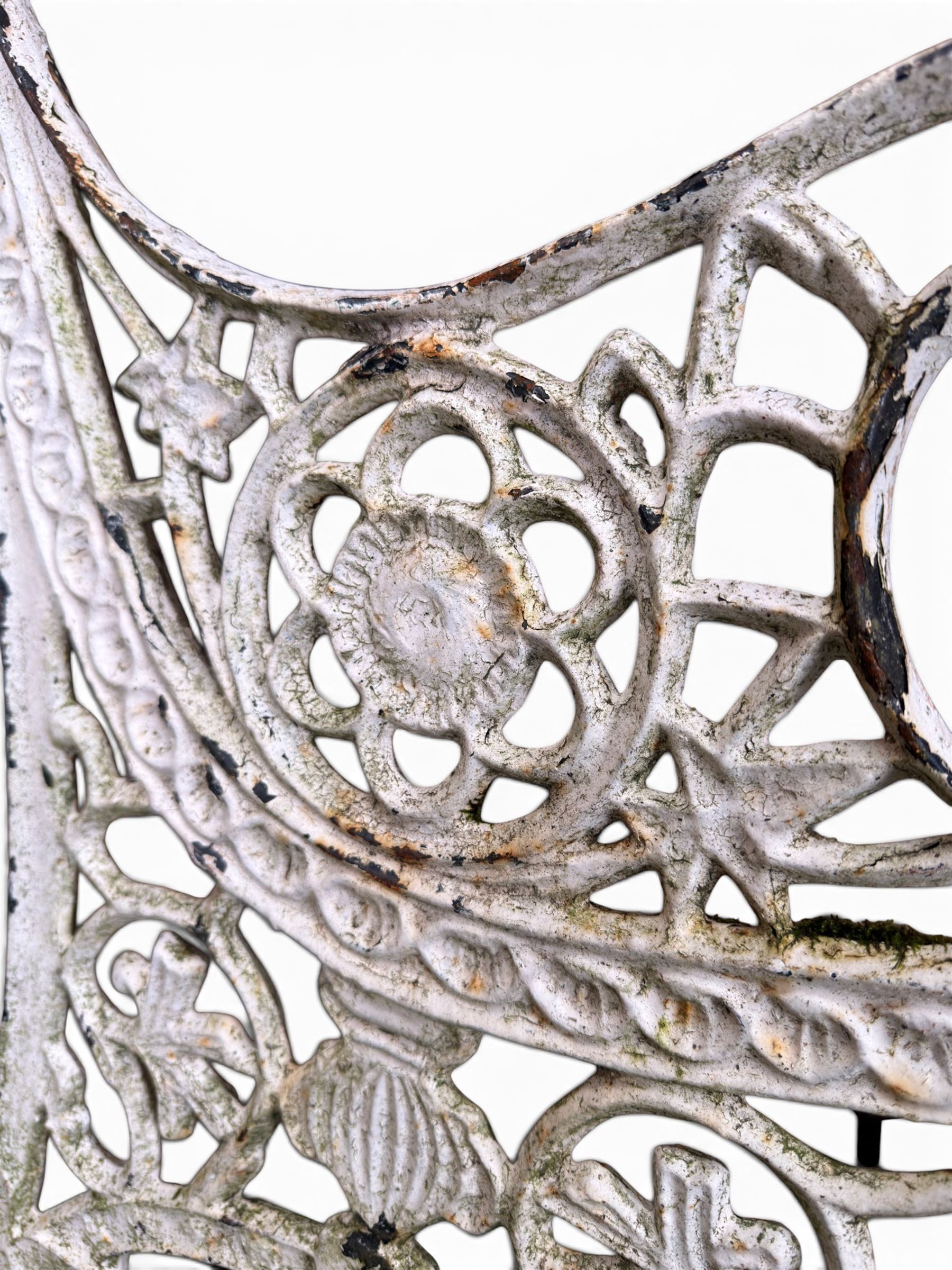 Pair of ornate painted cast iron bench ends, painted in white finish