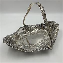 Edwardian silver swing handled basket, of navette form, with four repousse lion masks to each corner and with pierced and embossed floral, scroll and shell decoration to sides, base and handle, hallmarked Charles Horner, Birmingham 1906, height including handle H20cm
