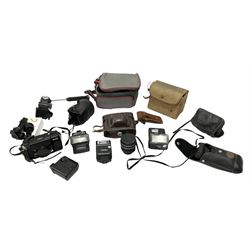 Quantity of cameras and accessories to include Olympus Trip 35, Minolta A f-EII 35mm, Yashica Auto Focus camera, Hanimex 35mm af camera in case, Kodak No.2A Folding Pocket Brownie camera in case, Minolta VLT-501 lens, etc