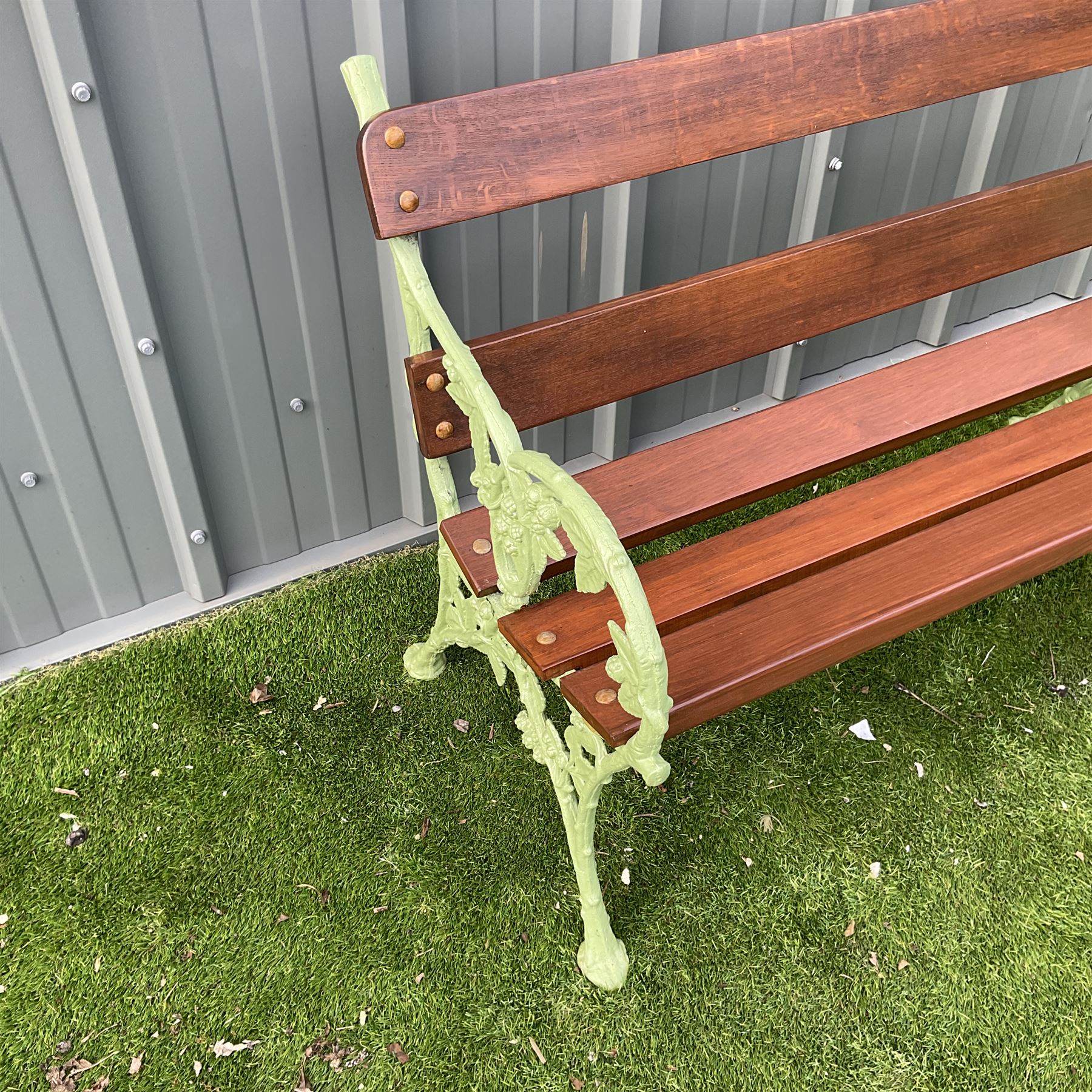 Green painted cast iron and wood slate bench decorated in grapevine - THIS LOT IS TO BE COLLECTED BY APPOINTMENT FROM DUGGLEBY STORAGE, GREAT HILL, EASTFIELD, SCARBOROUGH, YO11 3TX