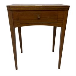 Mid-20th century teak sewing table, rectangular top with hinged fold-out extension revealing built-in Singer sewing machine, fitted with single hinged drawer, on square tapered supports; various Singer accessories to include Fashion Discs and Motor Controller