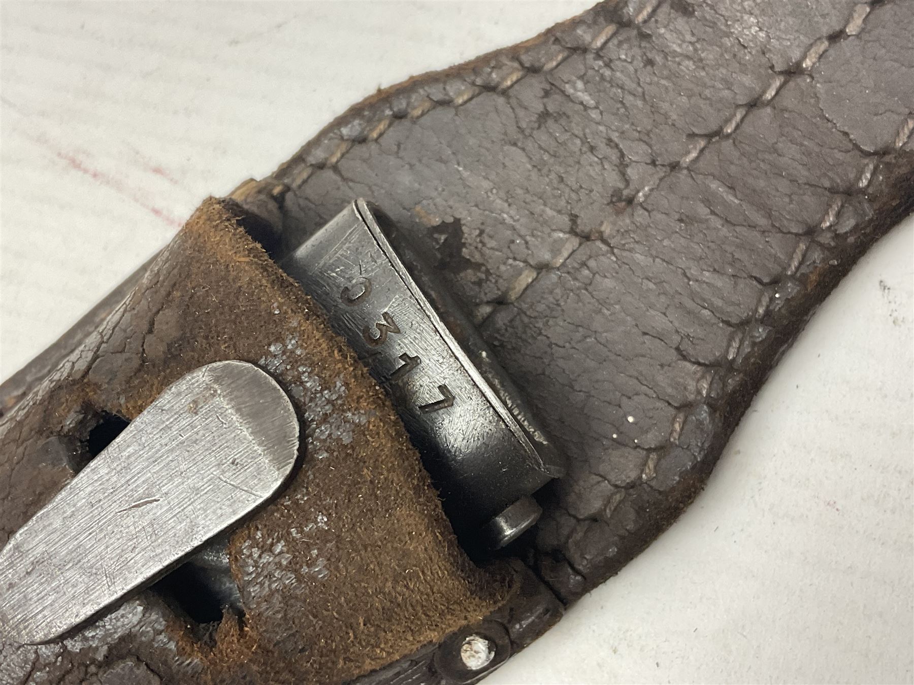 WWII German K98 Mauser bayonet by E. & F. Horster, the 24.5cm fullered blade marked 43aSW for 1943, numerous inspection marks to blade and pommel, bakelite grips and bluing to metal parts; in steel scabbard with corresponding numbers and leather frog L42cm overall