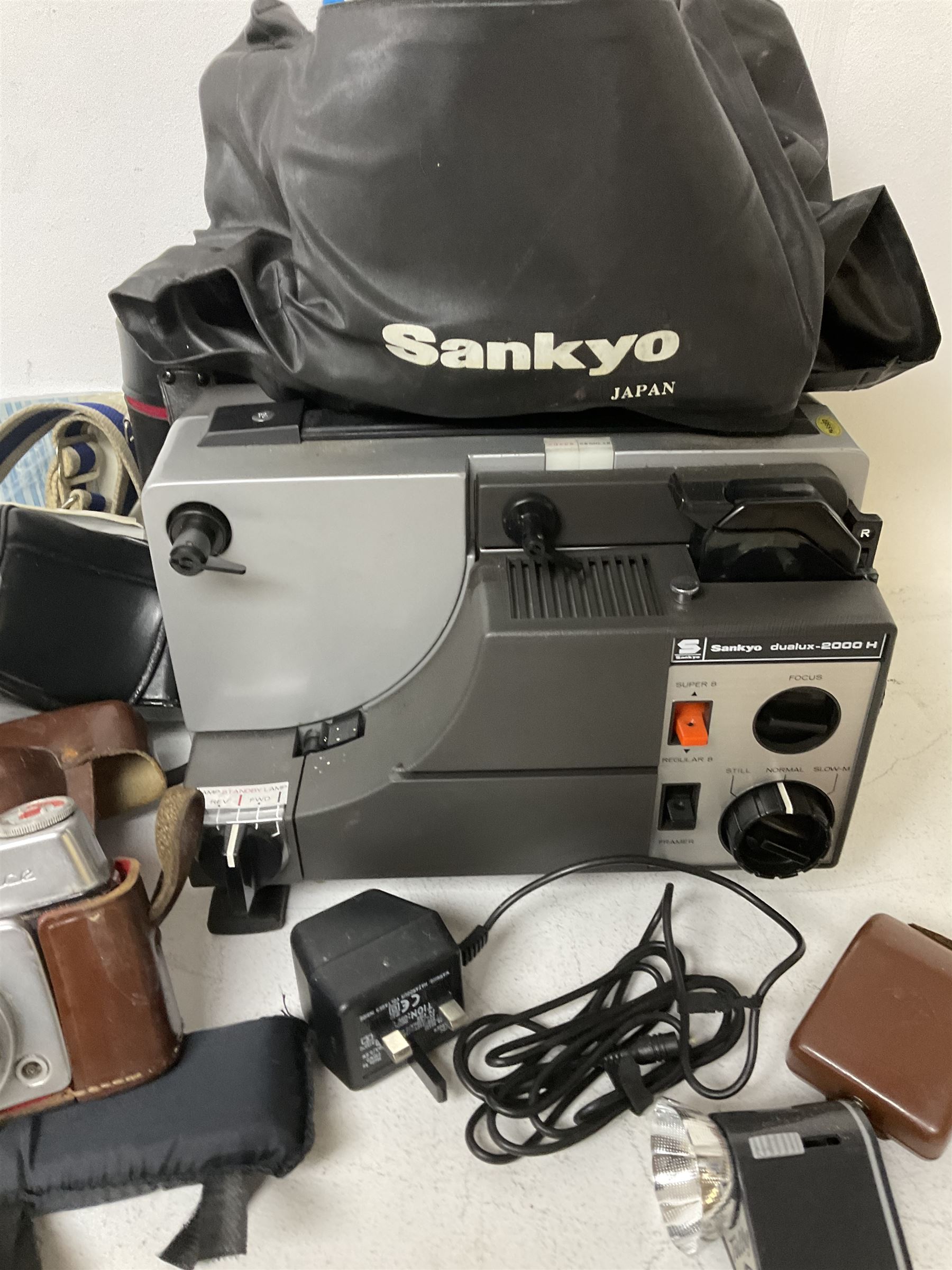 Sankyo Dualux-2000H projector, with cover, together with two vintage camera cases, etc
