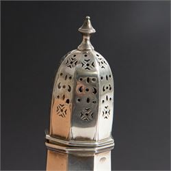 Edwardian silver sugar caster, of octagonal urn form, upon an octagonal foot, the removable pierced cover with urn finial, hallmarked Charles & George Asprey, London 1909, H21cm 