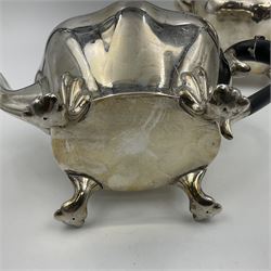 Five piece Edwardian silver tea service, comprising teapot and coffee pot, each with ebonised scroll handle, tea caddy with hinged cover, twin handled open sucrier, and milk jug, each of rounded bombe form, upon four paw feet, hallmarked William Adams Ltd, Birmingham 1904 and 1905, coffee pot H26cm
