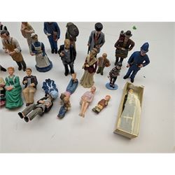 1:12 scale dolls house composite figures, including policeman, postman, maid, sitting and standing people in various styles of dress, etc