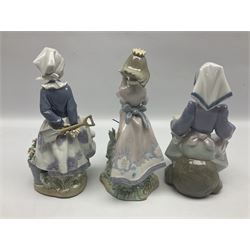 Three Lladro figures, comprising Land of Giants no 5716, Lap Full of Love no 5739 and Little Dutch Gardener no 5671, all with original boxes, largest example 22cm