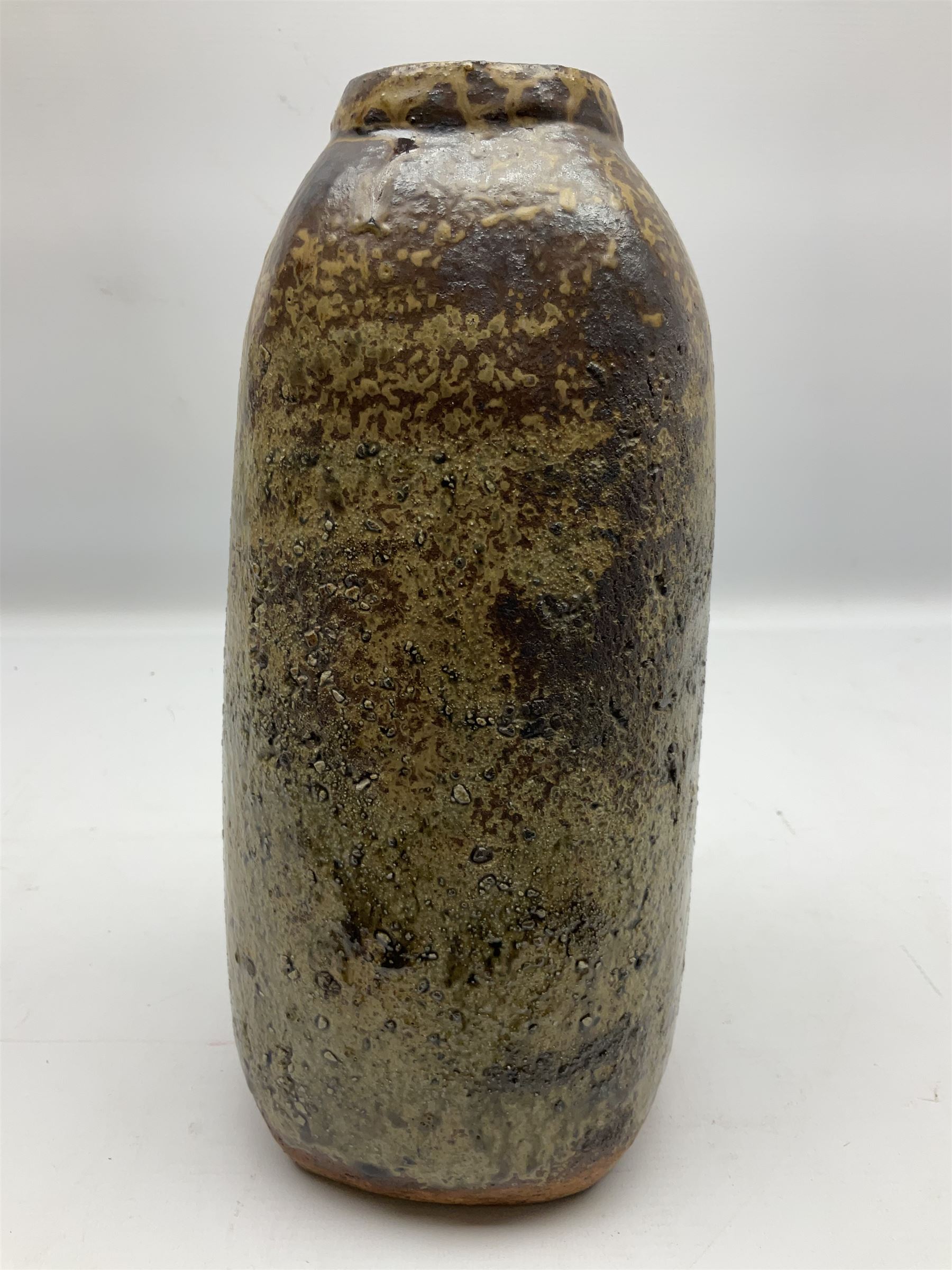 Janet Leach (American, 1918-1997) for Leach Pottery; studio pottery Bizen style vase of tapering form, the stoneware body decorated in a mottled green and brown dripped ash glaze, with impressed J.L. monogram and stamp marks beneath, H30cm