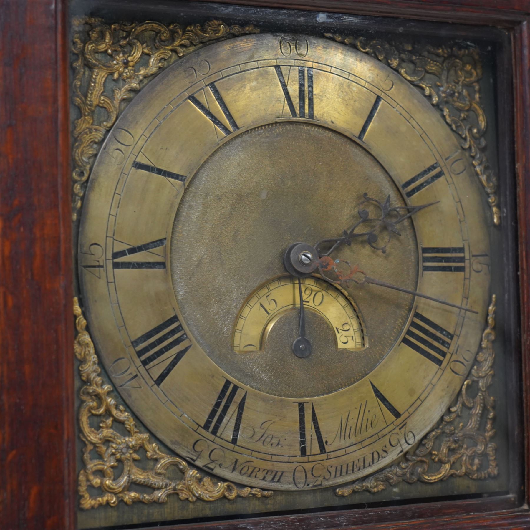 Joseph Millie of North Shields- oak cased 30hr longcase clock c1760, with a flat topped hood and deep frieze beneath, square hood door with side splats, long trunk with a conforming flat topped door with a square plinth raised on ball feet, brass dial with Rococo spandrels, matted dial centre and date aperture, chapter with Roman numerals, five minute Arabic's, minute track and matching steel hands, with a chain driven countwheel striking movement sounding the hours on a bell. With pendulum and weight.