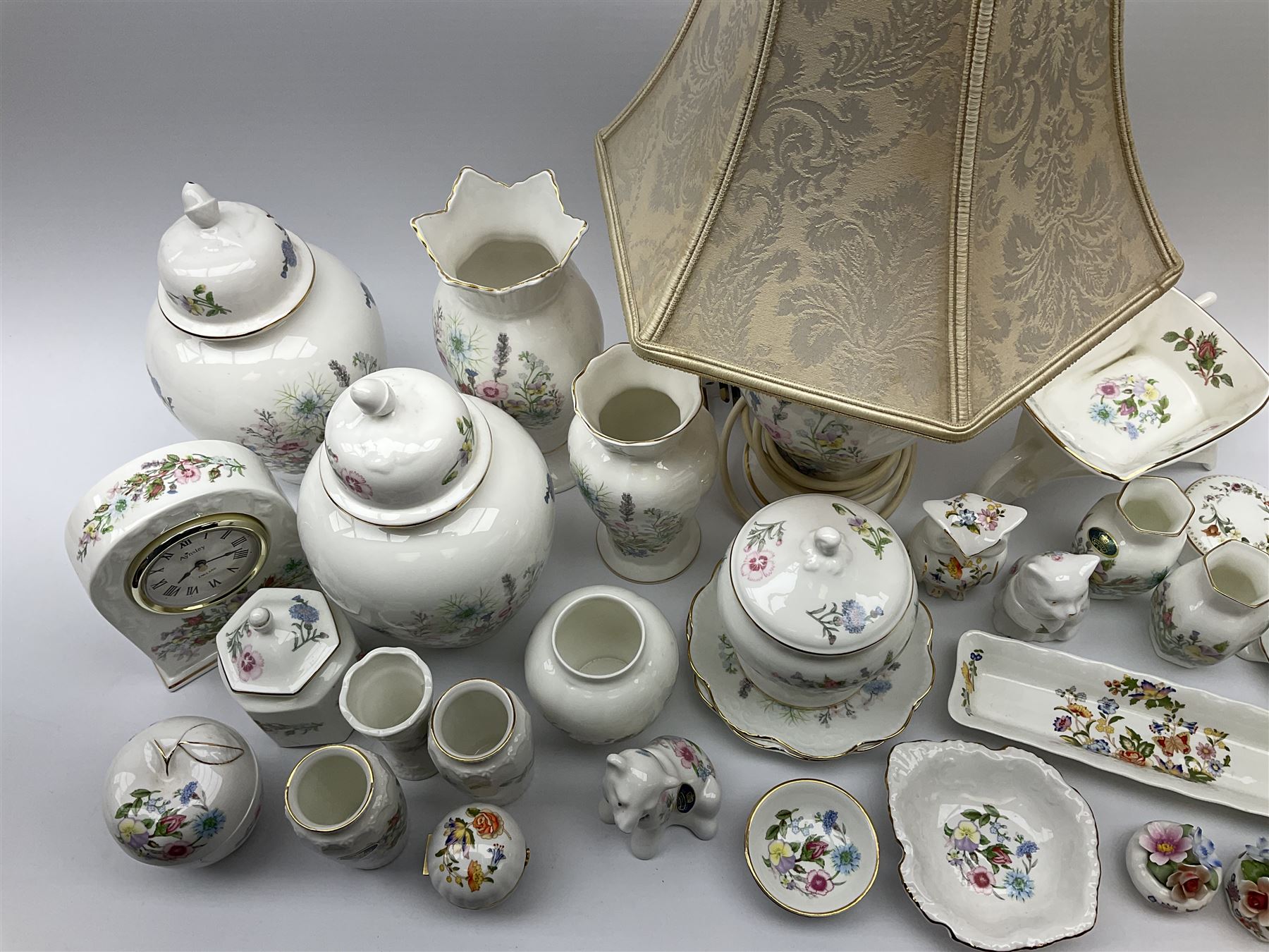 Collection of Aynsley Wild Tudor, including table lamp with shade, H48cm, clock, a selection of vases of various sizes etc, Aynsley cottage garden, trinket box, owl and ceramic floral decorations. 