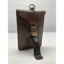 Early 20th century British Army officer's campaign clock in the form of a key-less wind nickel cased pocket watch with white dial, Roman numerals and subsidiary seconds dial, inscribed H. Williamson Ltd. London 9138F, the back with broad arrow and 9138F; in leather travelling case with dial aperture and brass easel support H14cm