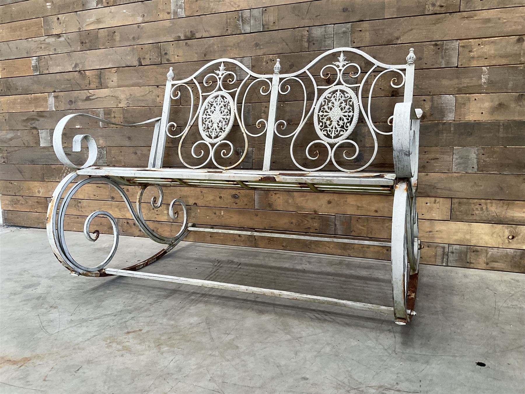 Wrought metal rocking garden bench seat, in antique grey finish