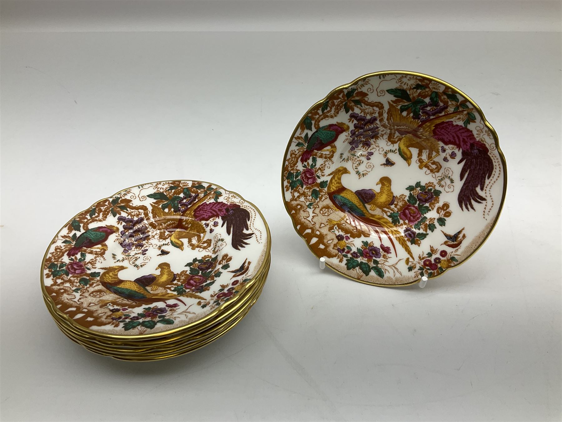 Royal Crown Derby Olde Avesbury pattern dinner and coffee service for six place settings, decorated with exotic birds amidst blossoming branches, comprising six dinner plates, six dessert plates, two tureen and covers, sauce boat and stand, oval serving platter, coffee pot, six coffee cans and six saucers, cream jug, and open sucrier, each with printed mark beneath