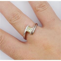 Platinum diamond ring, tension set with a single princess cut fancy yellow diamond of approx 0.60 carat, hallmarked