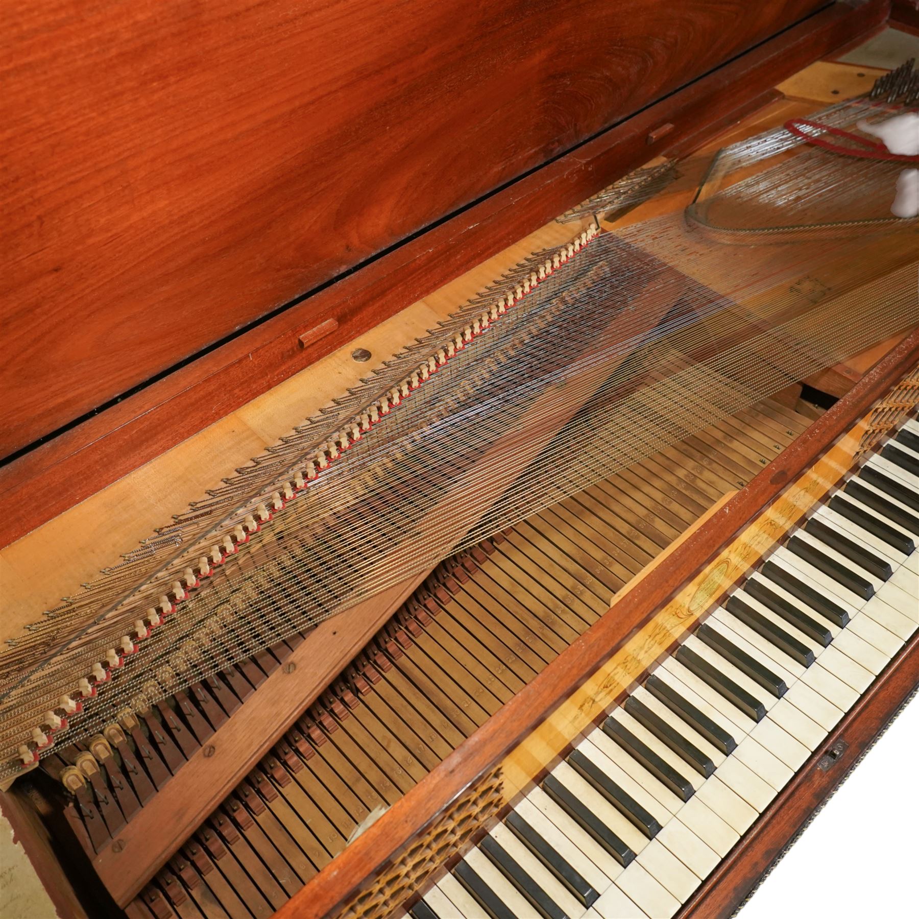 Early 19th century George IV Square Piano by William Rolfe & Co, 112 Cheapside, London, c1821. Mahogany veneered case with rosewood crossbanding and brass stringing, with sustain pedal and reeded legs on a tapered spiral with brass capitals, with three music draws beneath and a folding duet music stand, nameboard with makers name on a round gilt medallion and open silk backed fretwork to the ends, serial No 6699, double strung, English double action with 68 ivory and ebony keys, F1-C7. original strings, hammers and dampers, soundboard and bridge in good condition, with original makers written instructions on regulating the action and tuning the piano attached to the inside of the instrument. In good condition, however the action is in need of regulation and tuning.
William Rolfe is thought to have been in business between 1785 and 1828. 
Given the intricate nature of these historic instruments, specialist support will be available if required, to assist successful buyers with safe removal and onward handling. Price upon application.


This item has been registered for sale under section 10 of the APHA Ivory Act Reference PB6GL6SZ