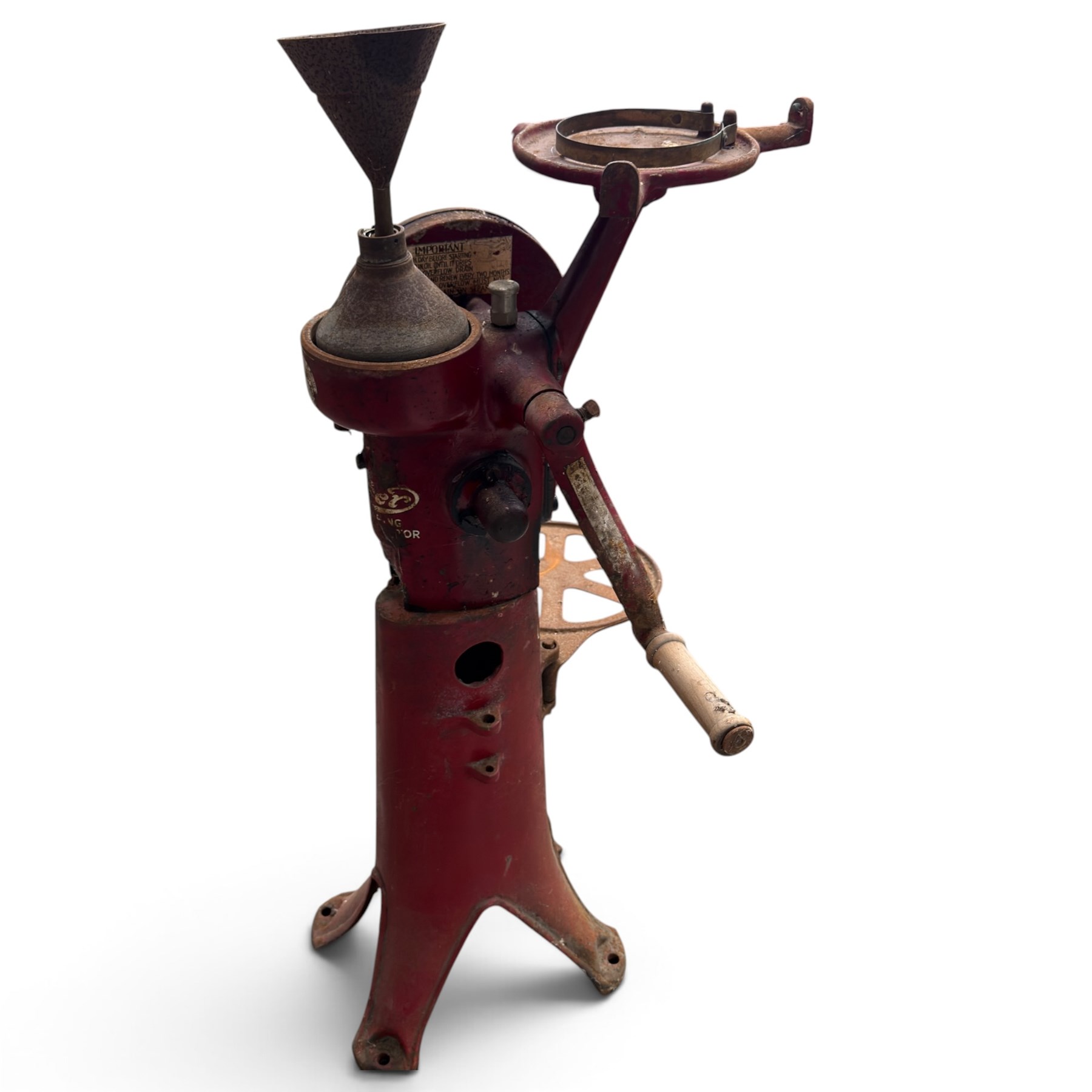 Two early 20th century dairy equipment items: Waide & Sons, Leeds – oak barrel butter churn with iron bands, later converted to electric operation, on trestle stand (W71cm H115cm); Lister – ‘Ball Bearing’ cast iron cream separator, with hopper and foot pedal, in red-painted finish (W47cm H49cm)