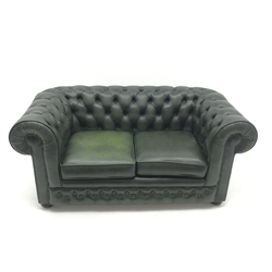  Two seat Chesterfield sofa, upholstered in deep buttoned green leather, bun feet, W164cm  