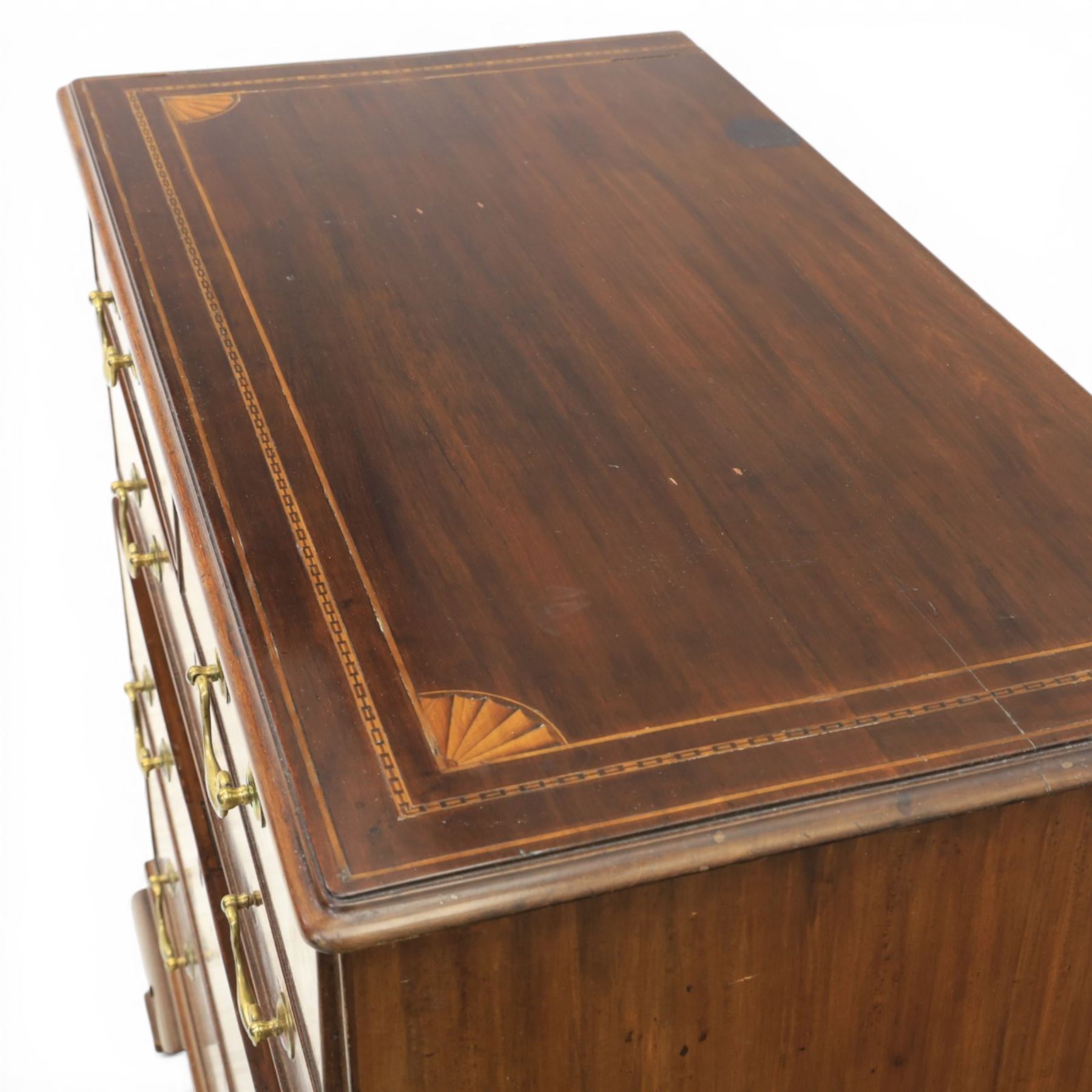 George III inlaid mahogany chest, shell inlaid and line chain detail, brass swan neck with cockbeaded edges, raised on bracket feet  