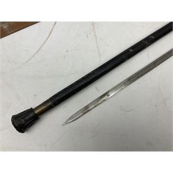 Early 20th century Indian ebonised sword stick, the 59.5cm blade with punched decoration and horn grip L94cm overall; and a reproduction Indian tulwar with scabbard (2)