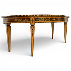 20th-Century Louis XVI-Style satinwood and penwork circular table or pair of console tables, the circular quarter-veneered top decorated in penwork with a central classical mask head motif within scrolling foliate and anthemion ornament on a contrasting black ground, above a conforming frieze decorated with Greek key-type scrolls. Raised on square tapering legs, each with an upper block panel decorated with compass-star motifs.