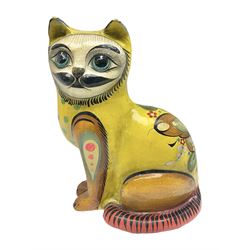 Papier mache model of a sitting cat, with painted floral and butterfly decoration, signed Serimel to base