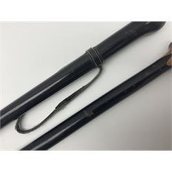 Two ebonised walking sticks, one with 'Leeds City Police' embossed top, tallest H92cm
