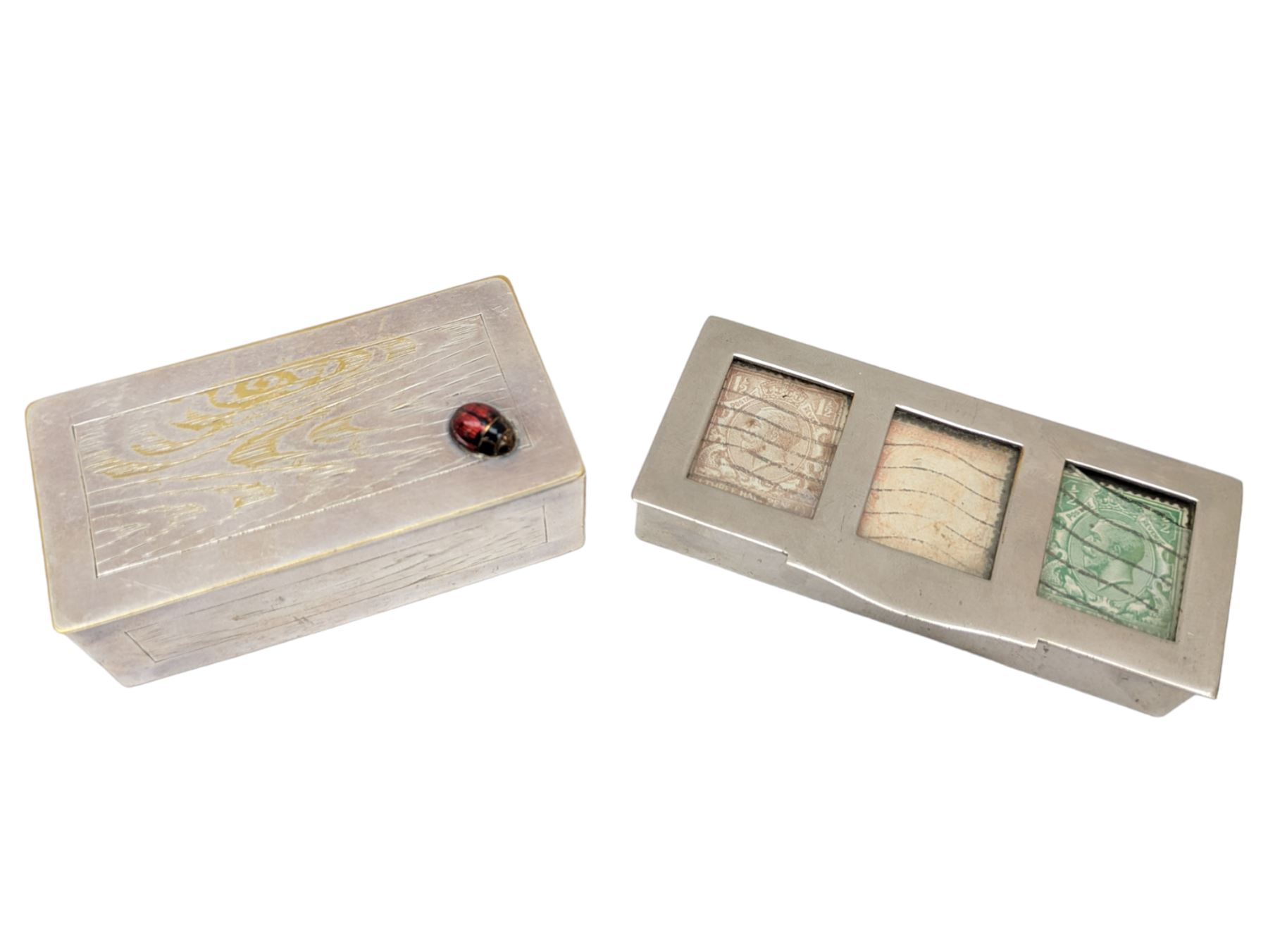 Two three division stamp boxes, the first with enamelled ladybird decoration and engraved initials to the inside of the hinged cover, the second with glass cover showing three King George V stamps
