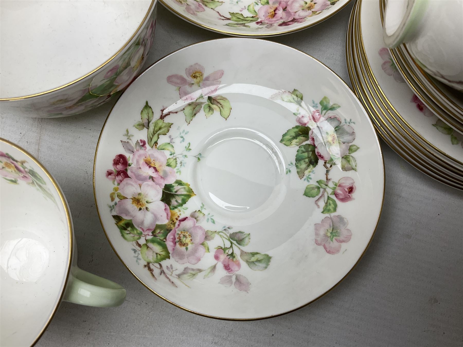 Royal Doulton Apple Blossom pattern tea service for twelve, comprising twelve saucers, twelve tea plates, twelve teacups, milk jug, sucrier and two cake plates