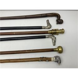 Six walking sticks including a walking stick with telescope to the top, carved resin cap modelled as an eagle with Yorkshire crest etc  
