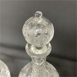 Pair of early 20th century cut glass decanters, each of ovoid form, the bodies deeply cut and etched with fruiting vines, the diamond cut necks supporting globular stoppers with conforming cut and etched decoration, H28cm