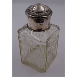 Early 20th century French silver mounted glass scent bottle, the faceted rectangular glass body etched with swags of flowers united by ribbons, with cylindrical silver cover embossed with foliate detail and beaded decoration with gilt interior, marked with Minerva's head, with white metal collar and glass stopper, H17cm