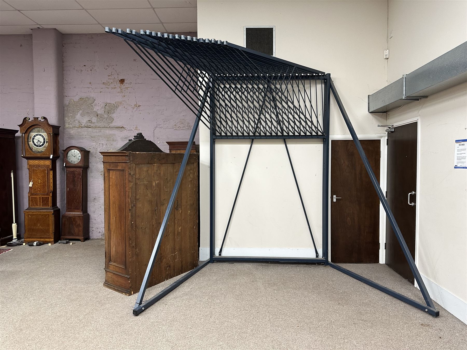 Commercial Rug Display Rack, painted steel, 20 swing arms, can fit 40 rugs back to back