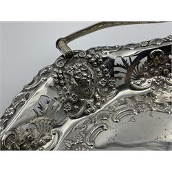 Edwardian silver swing handled basket, of navette form, with four repousse lion masks to each corner and with pierced and embossed floral, scroll and shell decoration to sides, base and handle, hallmarked Charles Horner, Birmingham 1906, height including handle H20cm