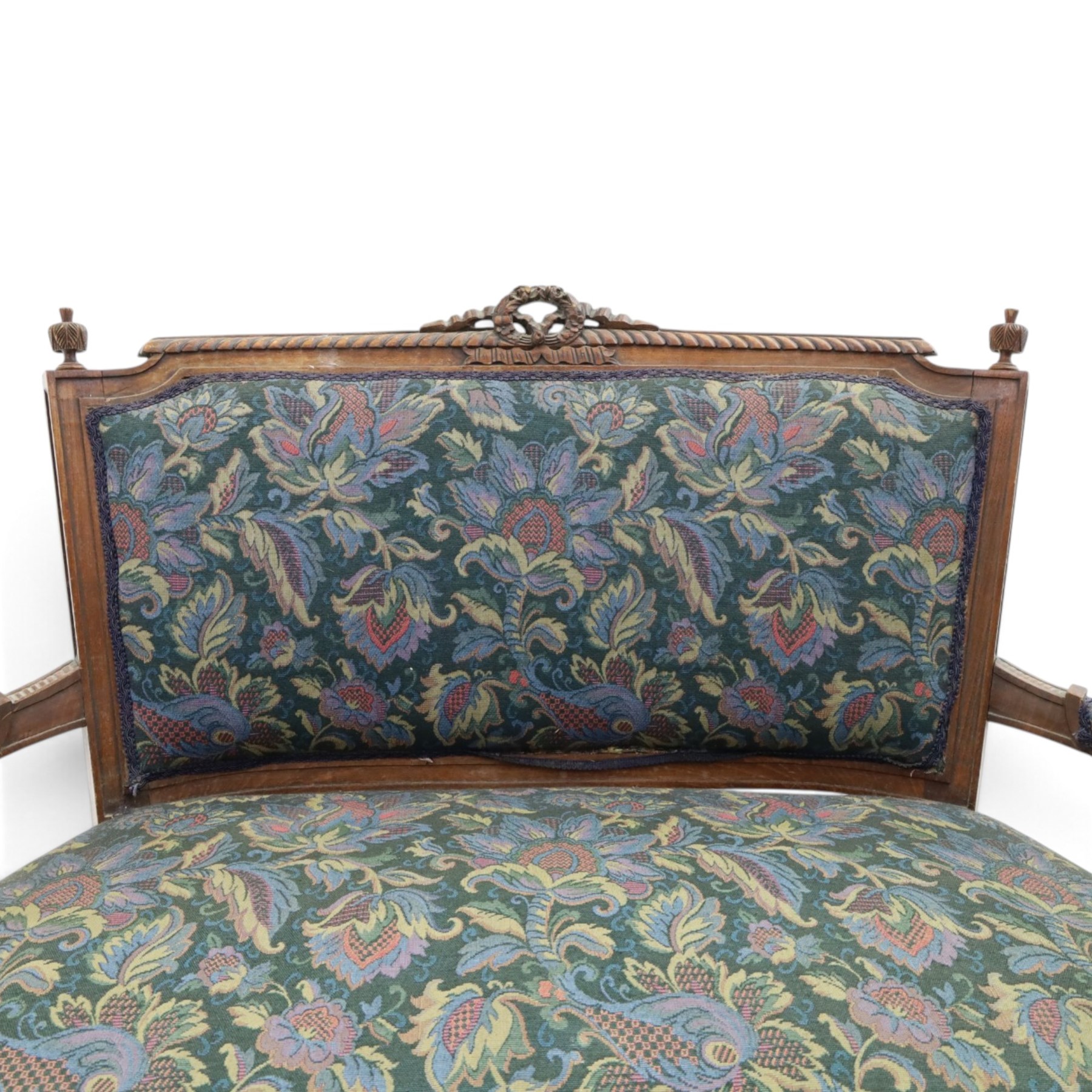 20th century French Louis XVI style stained beech two-seat salon settee, rectangular upholstered back and seat in floral tapestry fabric, carved and moulded frame with foliate cresting, padded open arms and fluted tapering supports