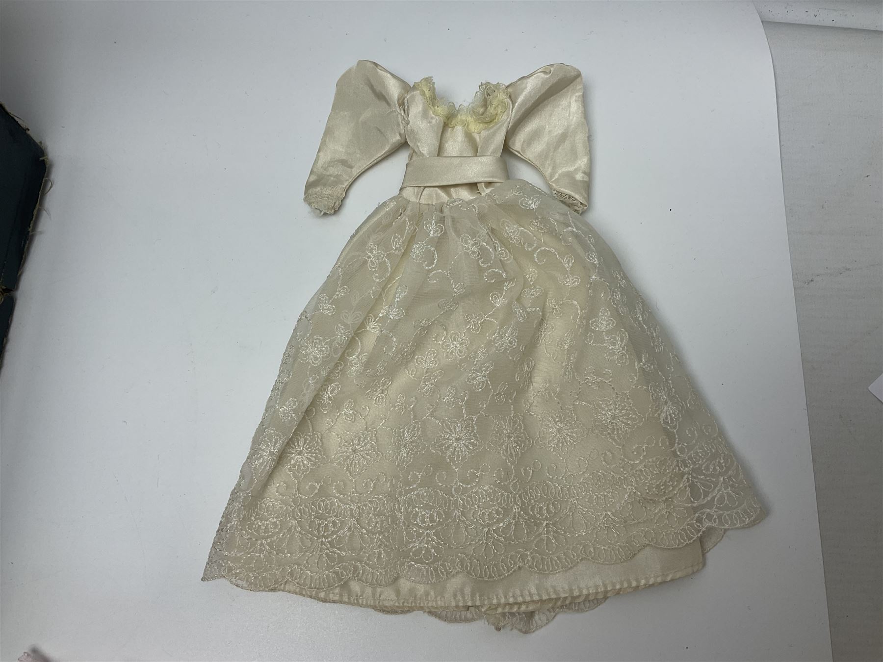 Early 20th century scratch-built wooden hat & gown shop diorama 'Joan', of double-fronted form glazed on three sides with brass and aluminium mounts, rear access apertures and storage under L63cm H45cm D31cm; with small collection of dresses and hats on display stands