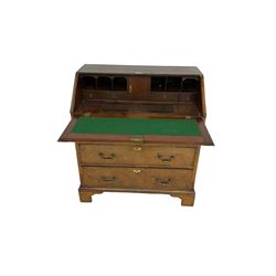George III mahogany and walnut bureau, fall-front concealing six pigeonholes and four drawers with central compartment with sliding lid, fitted with two short and two long drawers, on bracket feet