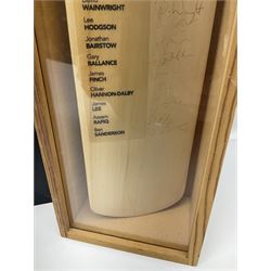 Two signed Yorkshire County cricket bats, bearing signatures including Anthony McGrath, Jacques Rudolph, Michael Vaughn and Matthew Hoggard, etc, both within glazed presentation boxes, box H86.5cm, together with a framed Darren Gough signed presentation print by Gary Keane