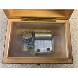 20th century burr wood Swiss musical box, marbled beneath 'made in Switzerland', paper label inscribed 'Around the world The Lass of Richmond Hill', H6.5cm W12.5cm D9cm