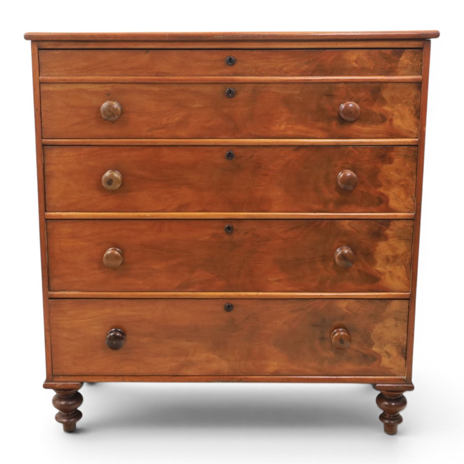 Victorian mahogany chest, with four long  flame mahogany fronted drawers with turned wooden knobs, raised on turned bun feet 