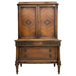 Early 20th century French walnut cabinet on chest, fitted with two segmented veneered cupboards above three drawers