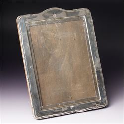 Silver upright photograph frame of plain design, aperture size 21cm x 15cm marks rubbed