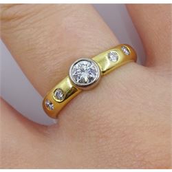 18ct gold diamond ring, the central bezel set diamond approx 0.25 carat, with two diamonds either side set in the shoulders by Peter Brewer, hallmarked
