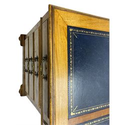 Early 20th century mahogany twin pedestal desk, the moulded rectangular top with three sectional leather insets with gilt decoration, fitted with eight drawers, on cabriole feet