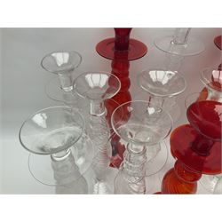 Thirteen glass candle sticks with twist knopped stem, in various sizes, tallest H51cm 