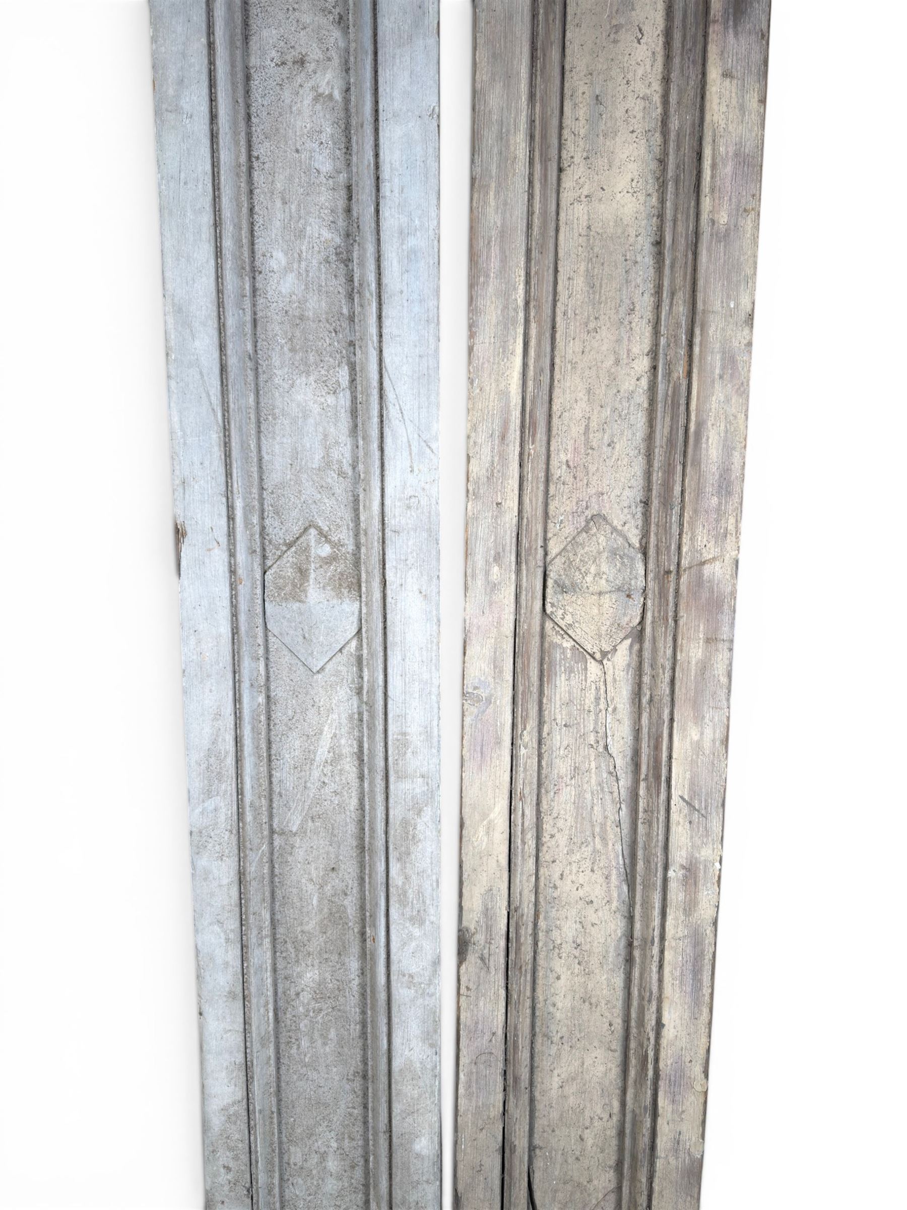 Pair of 19th century pine architectural pilasters, with painted terracotta capitols, with acanthus and scroll detail (18cm x 15cm x 57cm)