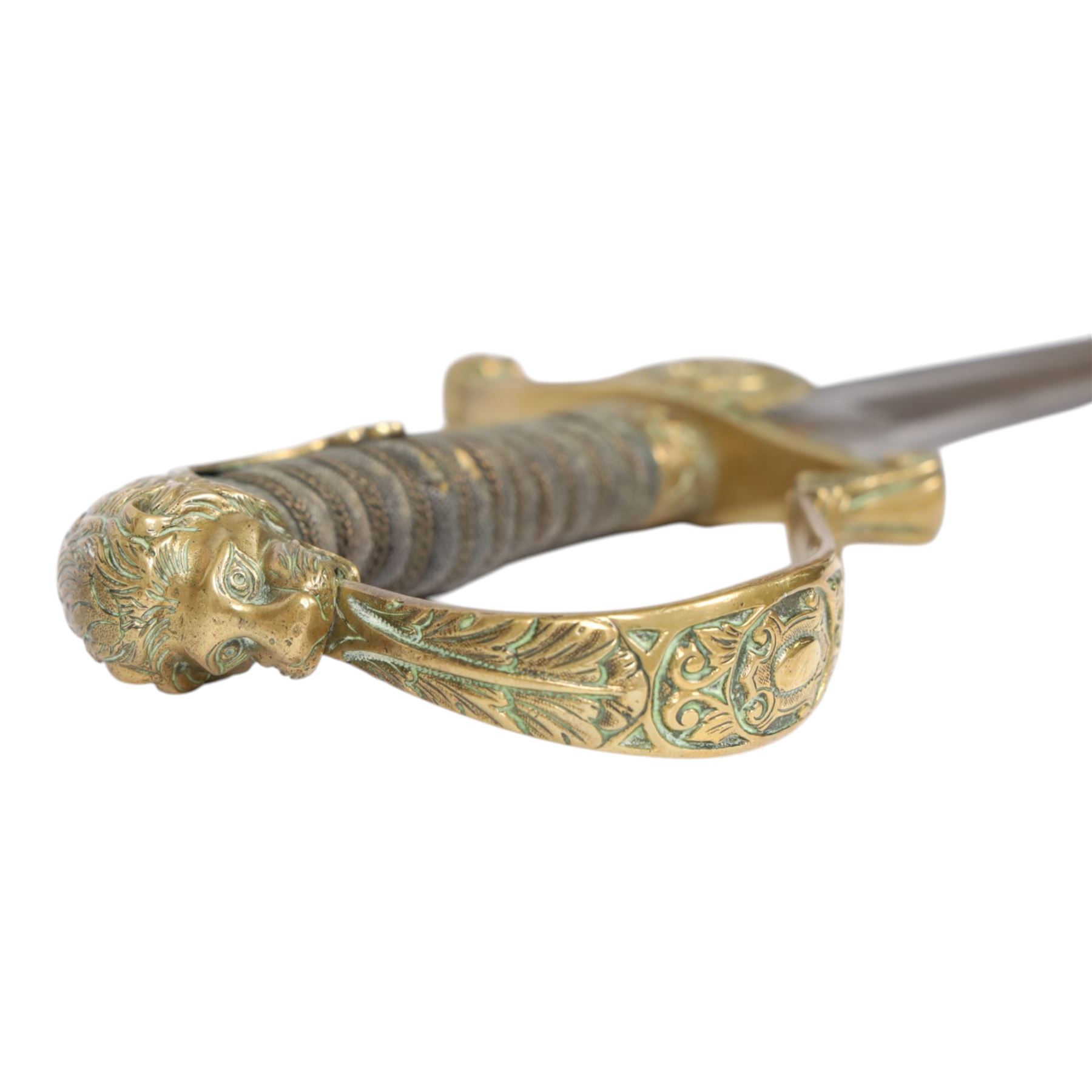 WWI Prussian Artillery Officer's dress sword, with 83cm single edge fullered steel blade, brass stirrup hilt, the langet with crossed cannon barrels and a vacant shield cartouche, the curved knuckle bow cast with acorns and oak leaves, wire bound grip and lion head pommel, with steel scabbard, overall L100cm